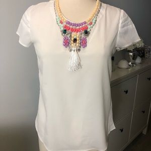 White tee with colorful beaded neckline